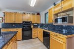 Full kitchen with granite counter tops and upgraded appliances